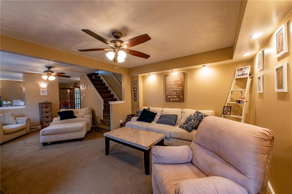 44 Rowe Street Rural Ridge, PA 15075 - Photo 13 of 25 a living room with furniture and a chandelier