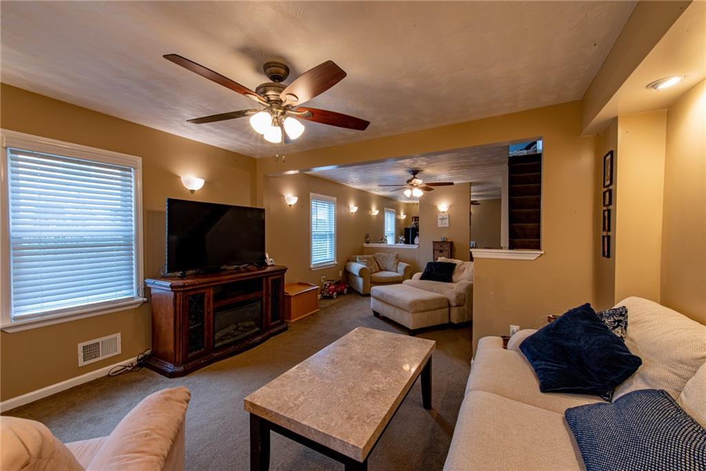 44 Rowe Street Rural Ridge, PA 15075 - Photo 14 of 25 a living room with furniture and a flat screen tv