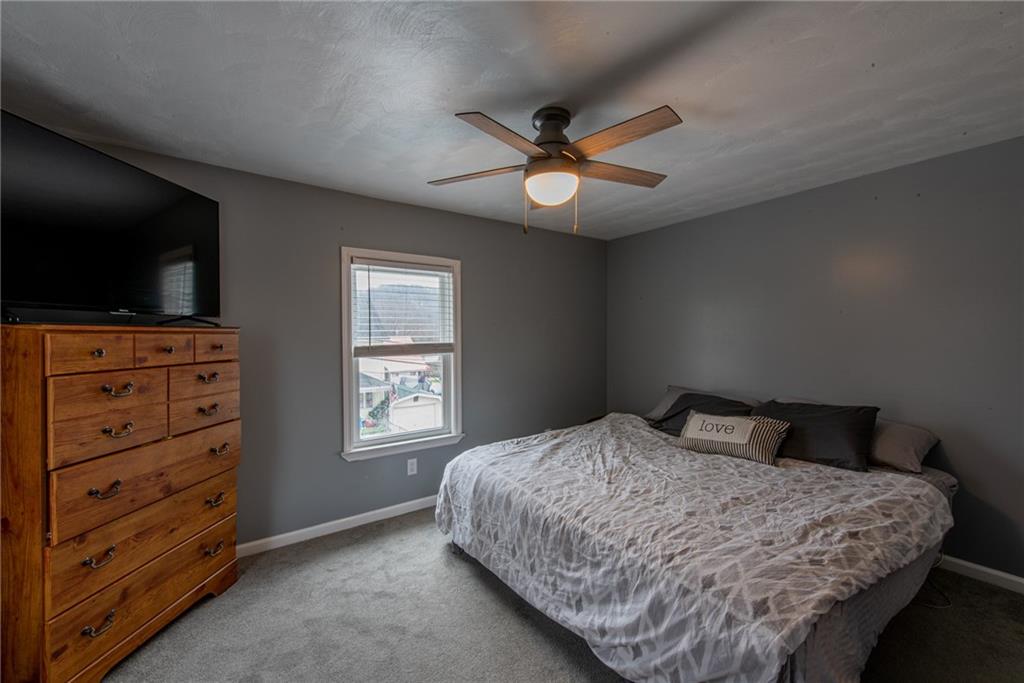 44 Rowe Street Rural Ridge, PA 15075 - Photo 17 of 25 a bedroom with a bed and a flat screen tv