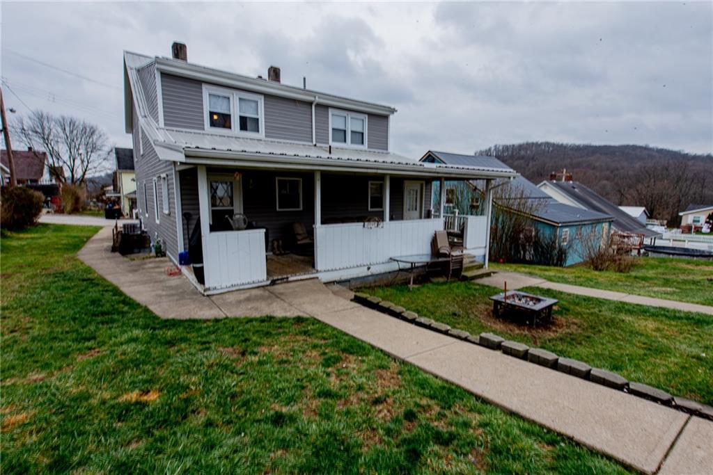 44 Rowe Street Rural Ridge, PA 15075 - Photo 24 of 25 a front view of a house with a yard
