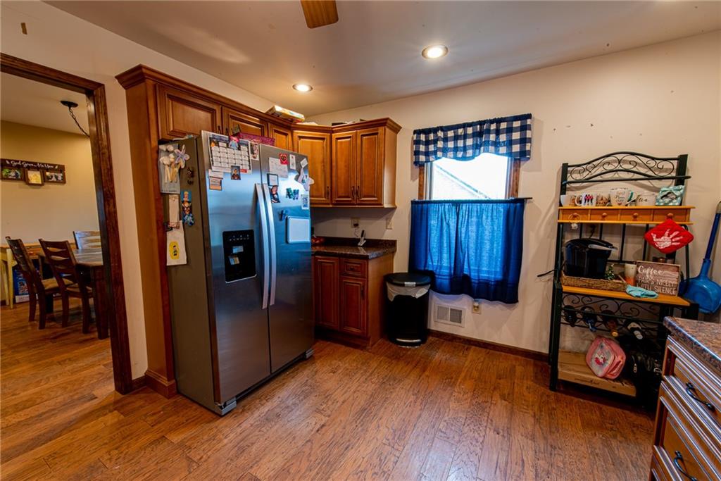 44 Rowe Street Rural Ridge, PA 15075 - Photo 4 of 25 a kitchen with stainless steel appliances granite countertop a refrigerator and a stove