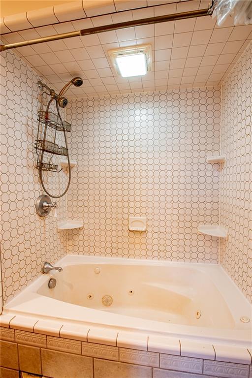 44 Rowe Street Rural Ridge, PA 15075 - Photo 6 of 25 a bathroom with a bathtub and a shower