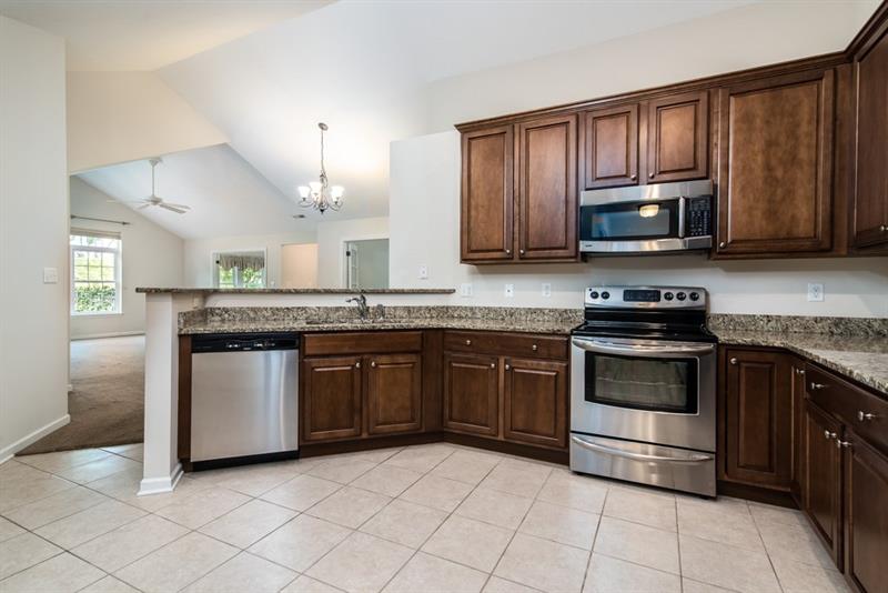 1073 Wealdstone Road Cranberry Township, PA 16066 - Photo 12 of 25 View of the kitchen looking into the dining room and living room area.