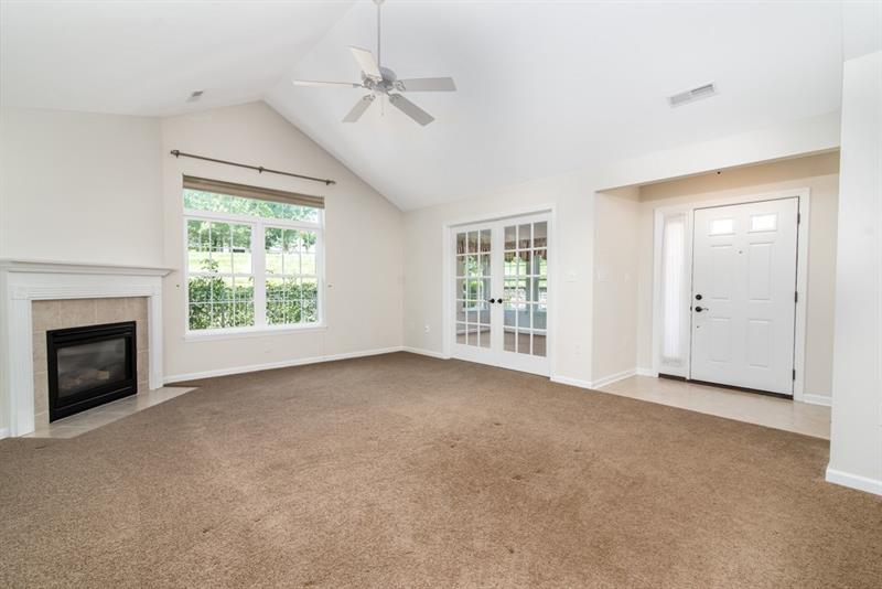 1073 Wealdstone Road Cranberry Township, PA 16066 - Photo 4 of 25 Ceramic entry welcomes you into this open floor plan with Cathedral ceilings. This photo shows the living room and the closed glass doors is the sun room.