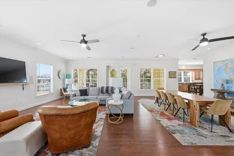 a living room with furniture or couch and a wooden floor