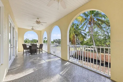 a kitchen with stainless steel appliances granite countertop table chairs sink and cabinets