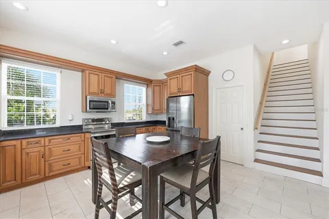 a kitchen with granite countertop a stove a sink and a granite counter tops