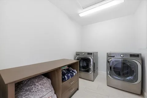 a bathroom with a tub a window and a shower