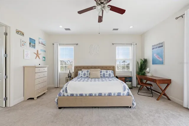 an aerial view of residential house with outdoor space and trees all around