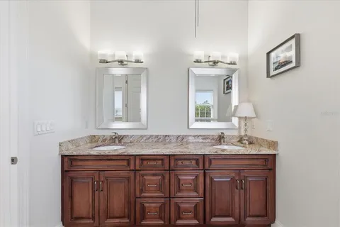 an aerial view of residential houses with city view