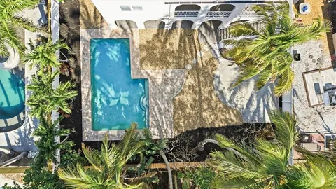 a front view of a house with a yard and a garage