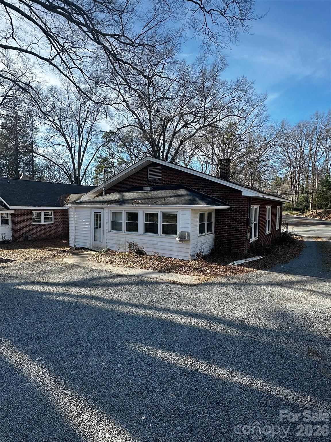 1803 West Main Street Albemarle, NC 28001 - Photo 2 of 13 a front view of a house with a yard