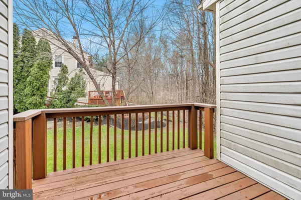 a balcony with wooden floor