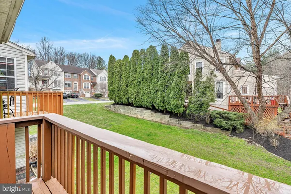 a view of a garden with large trees