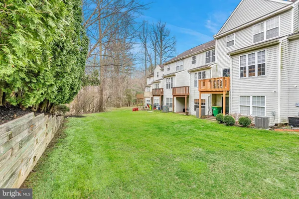 a view of an apartment with a backyard