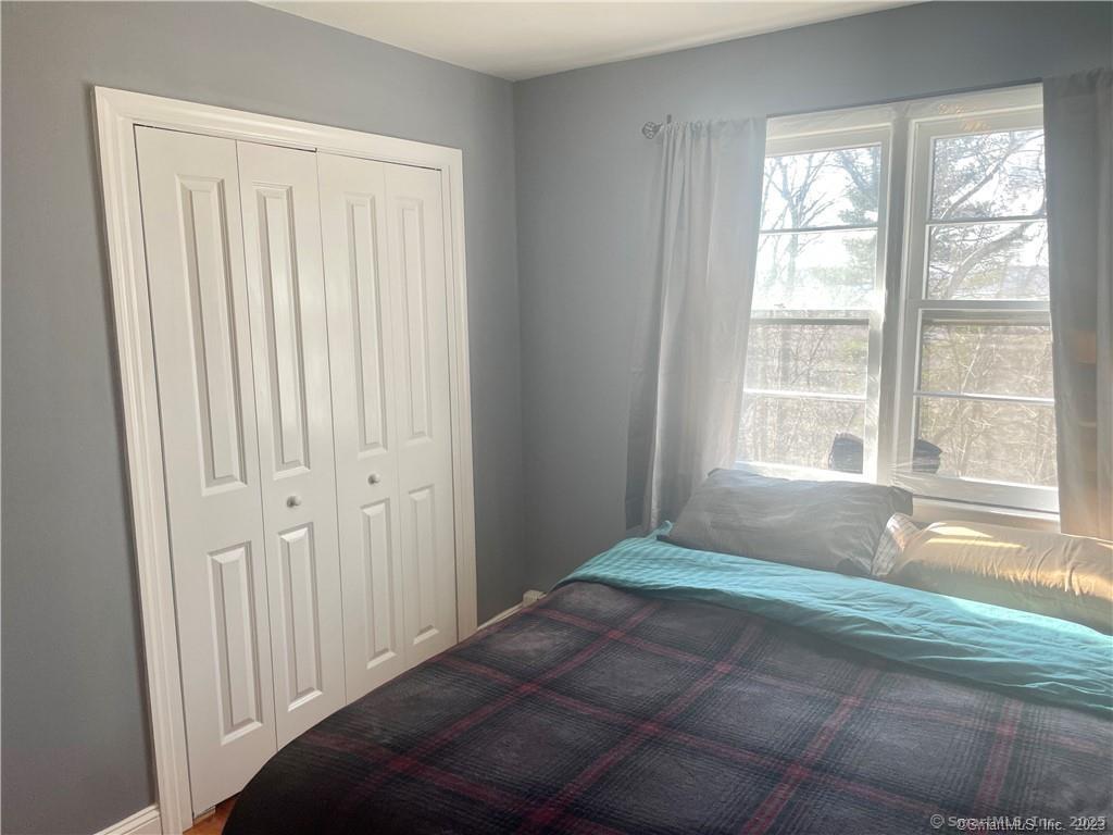 55 Oak Ridge Drive, Unit 60 New Haven, CT 06513 - Photo 9 of 16 a bedroom with a bed and a window