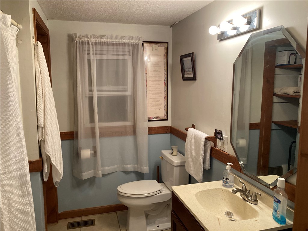 155 Hickory Ridge Mountain Rest, SC 29664 - Photo 20 of 21 A classic vanity mirror and clean basin define this functional washroom space.