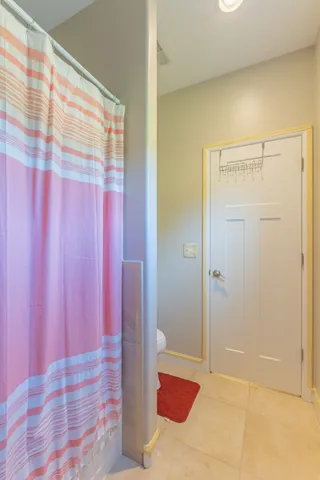 a bedroom with bed and window