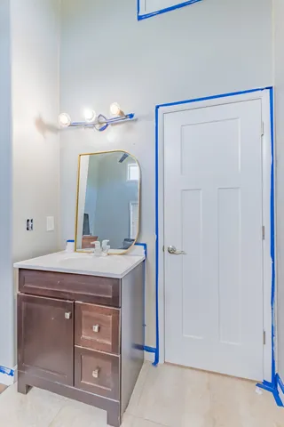 a white toilet sitting next to a sink