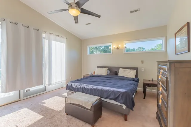 a room with wooden floor and furniture
