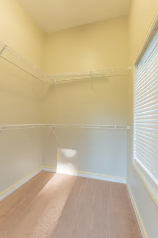 a bedroom with a bed and a tv