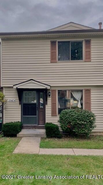 3948 Hunters Ridge Drive, Unit 4 Lansing, MI 48911 - Photo 1 of 23 Front