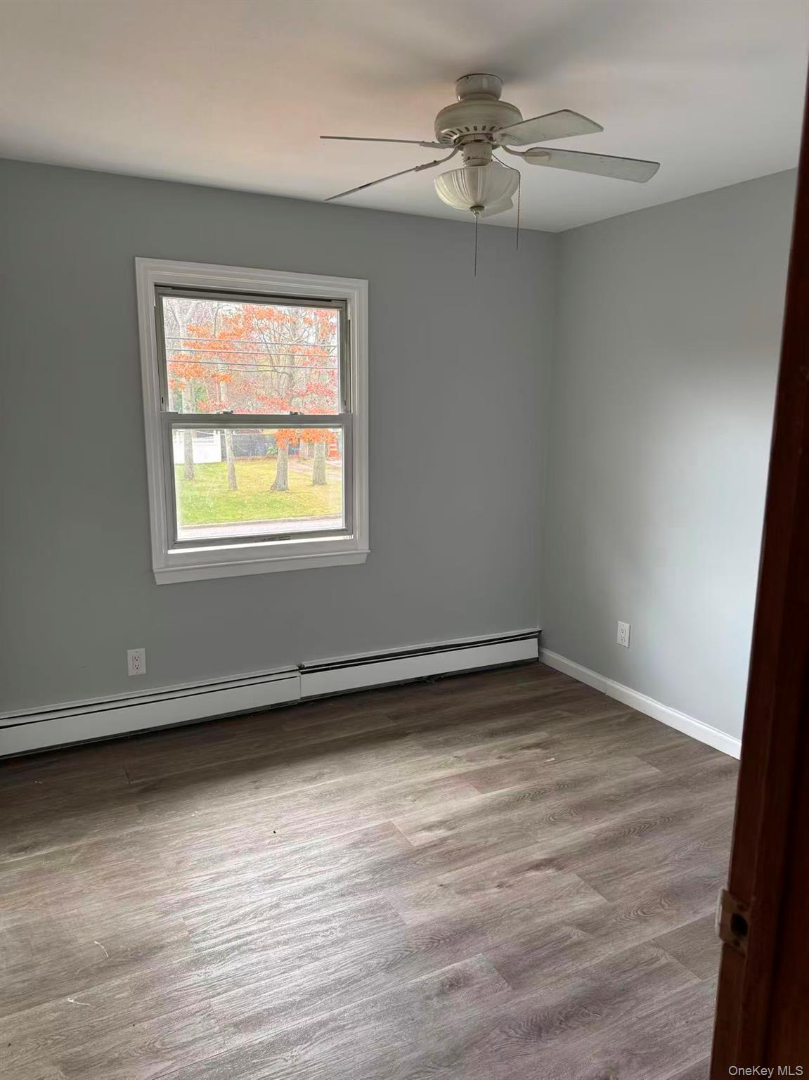 20 Westfield Road Coram, NY 11727 - Photo 12 of 21 an empty room with a window