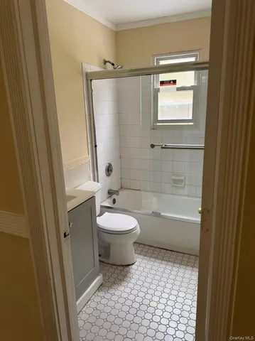 a bathroom with a toilet a sink and bathtub