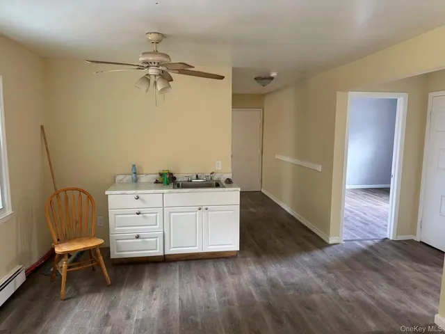 a room with a chair and a dresser