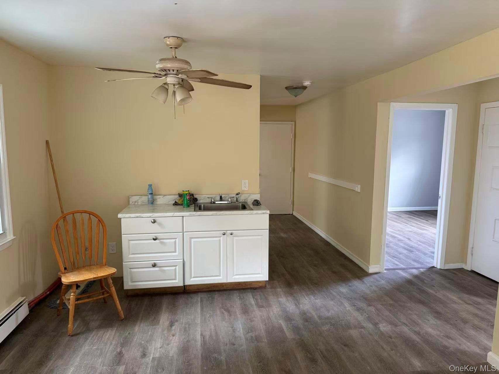 20 Westfield Road Coram, NY 11727 - Photo 5 of 21 a room with a chair and a dresser