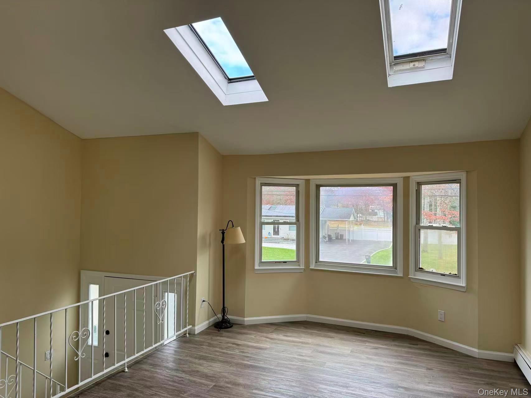 20 Westfield Road Coram, NY 11727 - Photo 6 of 21 a view of an empty room with wooden floor and a window