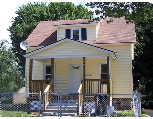 207 Jasper Street Springfield, MA 01109 - Photo 1 of 1 a front view of a house with a yard