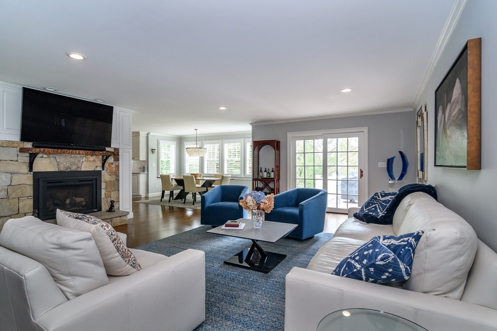 1098 Webster Street Needham, MA 02492 - Photo 5 of 21 a living room with furniture a flat screen tv and a fireplace