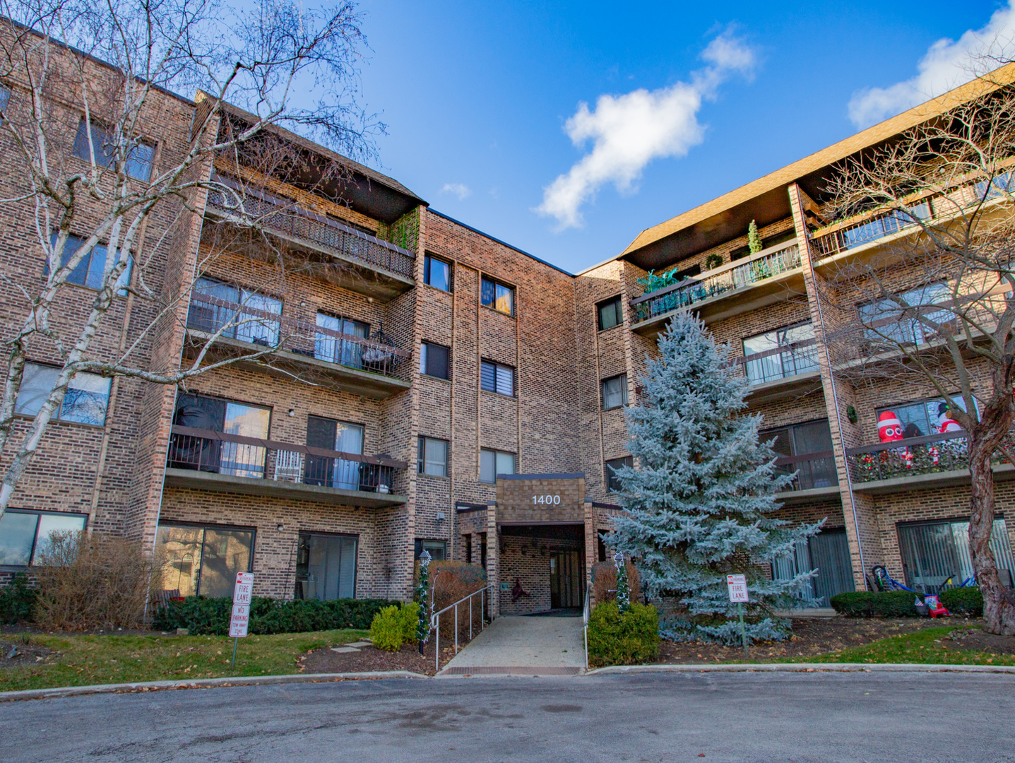 1400 North Elmhurst Road, Unit 213 Mount Prospect, IL 60056 - Photo 1 of 14 a front view of a building