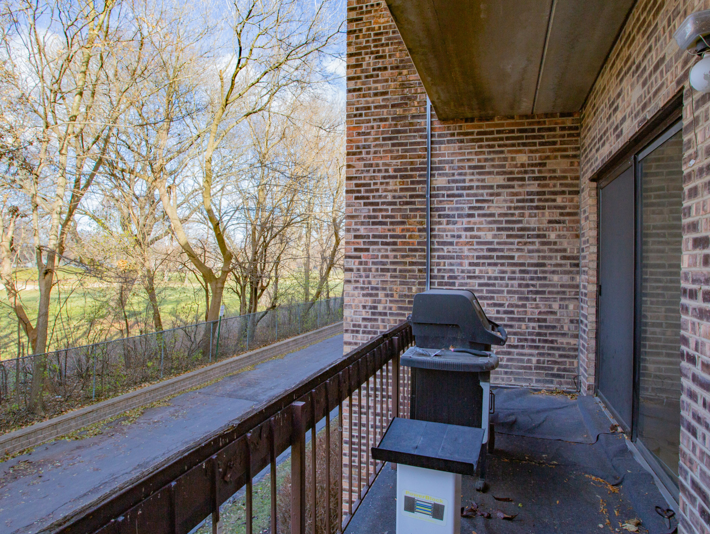 1400 North Elmhurst Road, Unit 213 Mount Prospect, IL 60056 - Photo 13 of 14 a view of a brick wall and a window