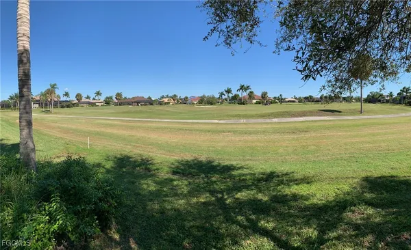 a view of an ocean with a mountain view