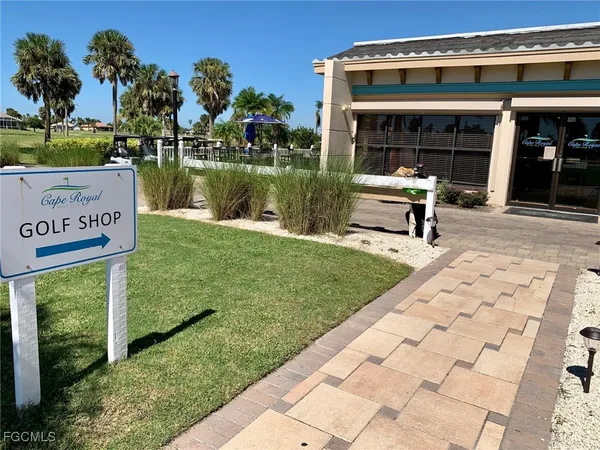 a view of a chairs and table on the wooden deck