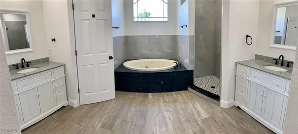 a bathroom with a sink a mirror and a toilet