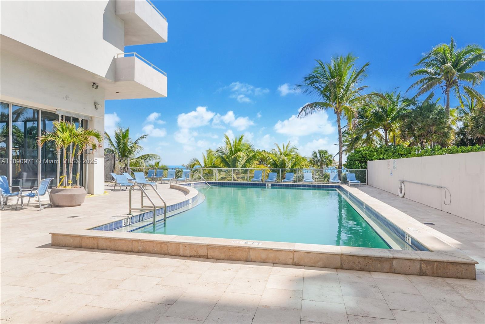9225 Collins Avenue, Unit 501 Surfside, FL 33154 - Photo 11 of 12 a view of swimming pool with a lounge chairs