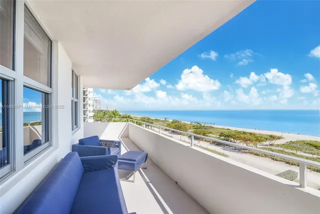 a view of balcony with furniture and city view