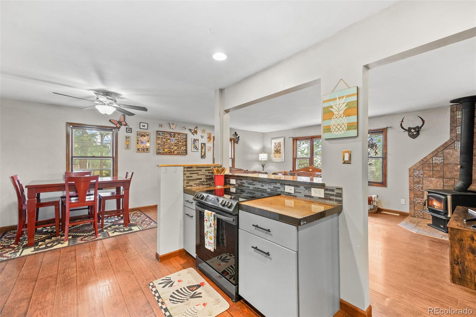 41 Yew Lane Bailey, CO 80421 - Photo 18 of 47 a kitchen with stainless steel appliances granite countertop a stove and a dining table