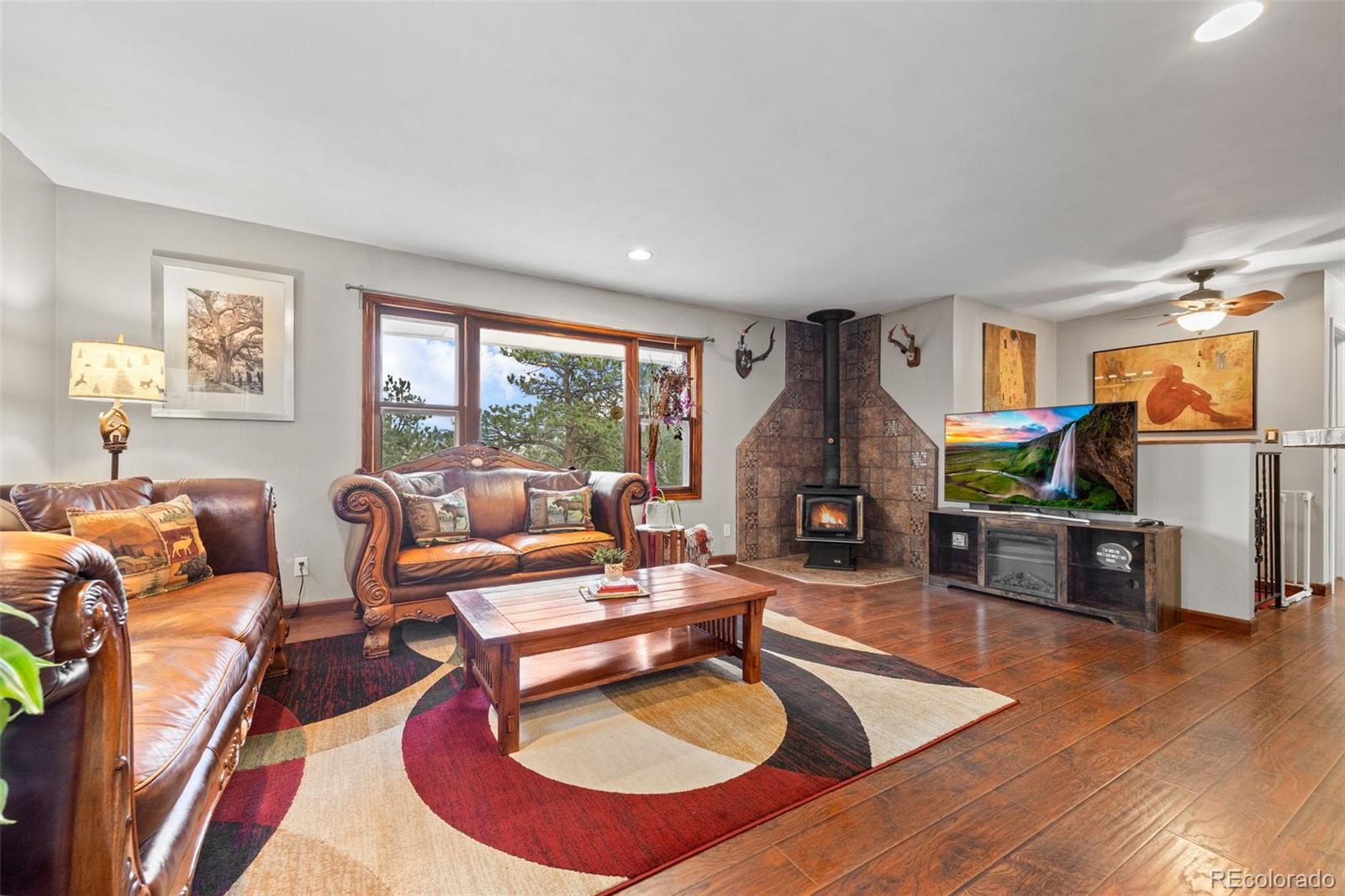 41 Yew Lane Bailey, CO 80421 - Photo 22 of 47 a living room with furniture and a fireplace