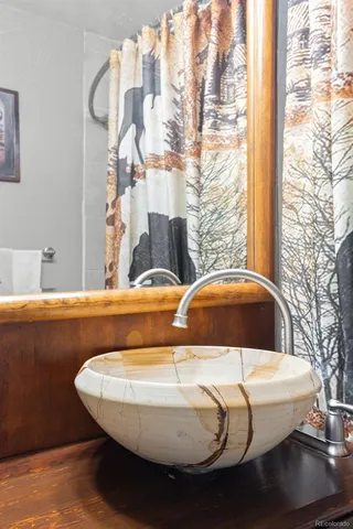 a view of a balcony with table and chairs