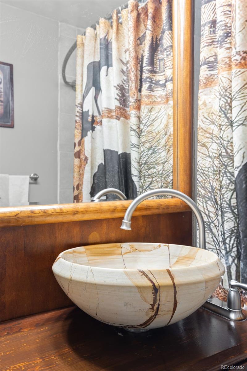 41 Yew Lane Bailey, CO 80421 - Photo 28 of 47 a view of a balcony with table and chairs