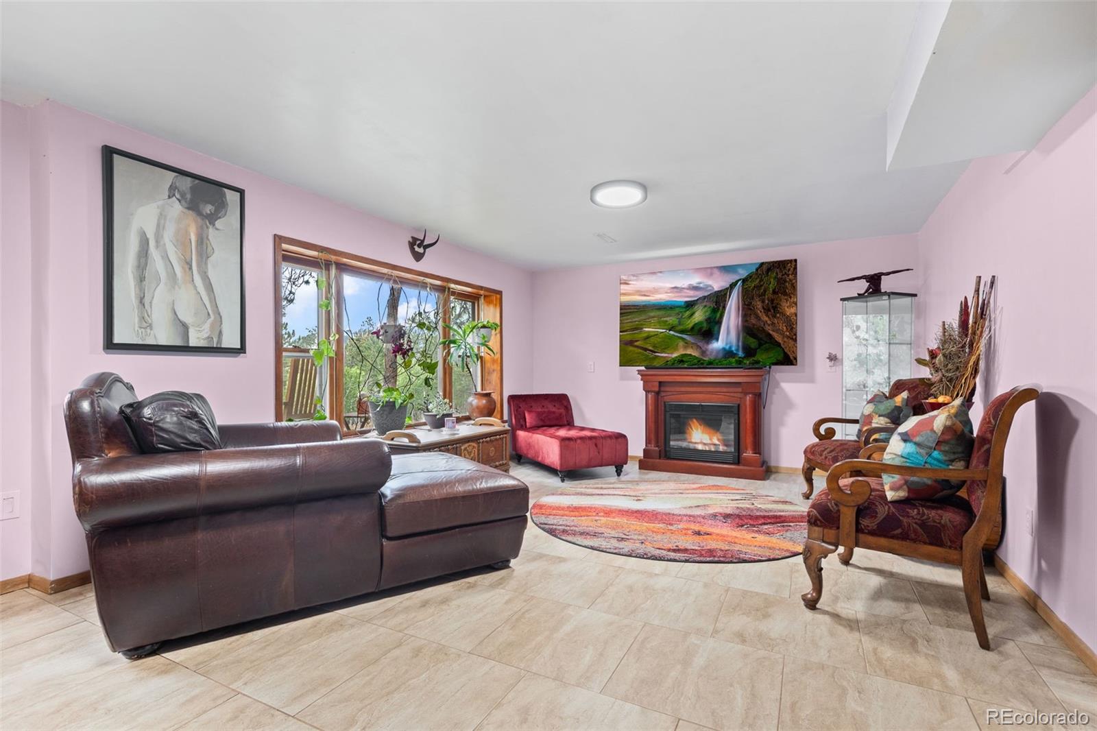 41 Yew Lane Bailey, CO 80421 - Photo 32 of 47 a living room with fireplace furniture and a large window