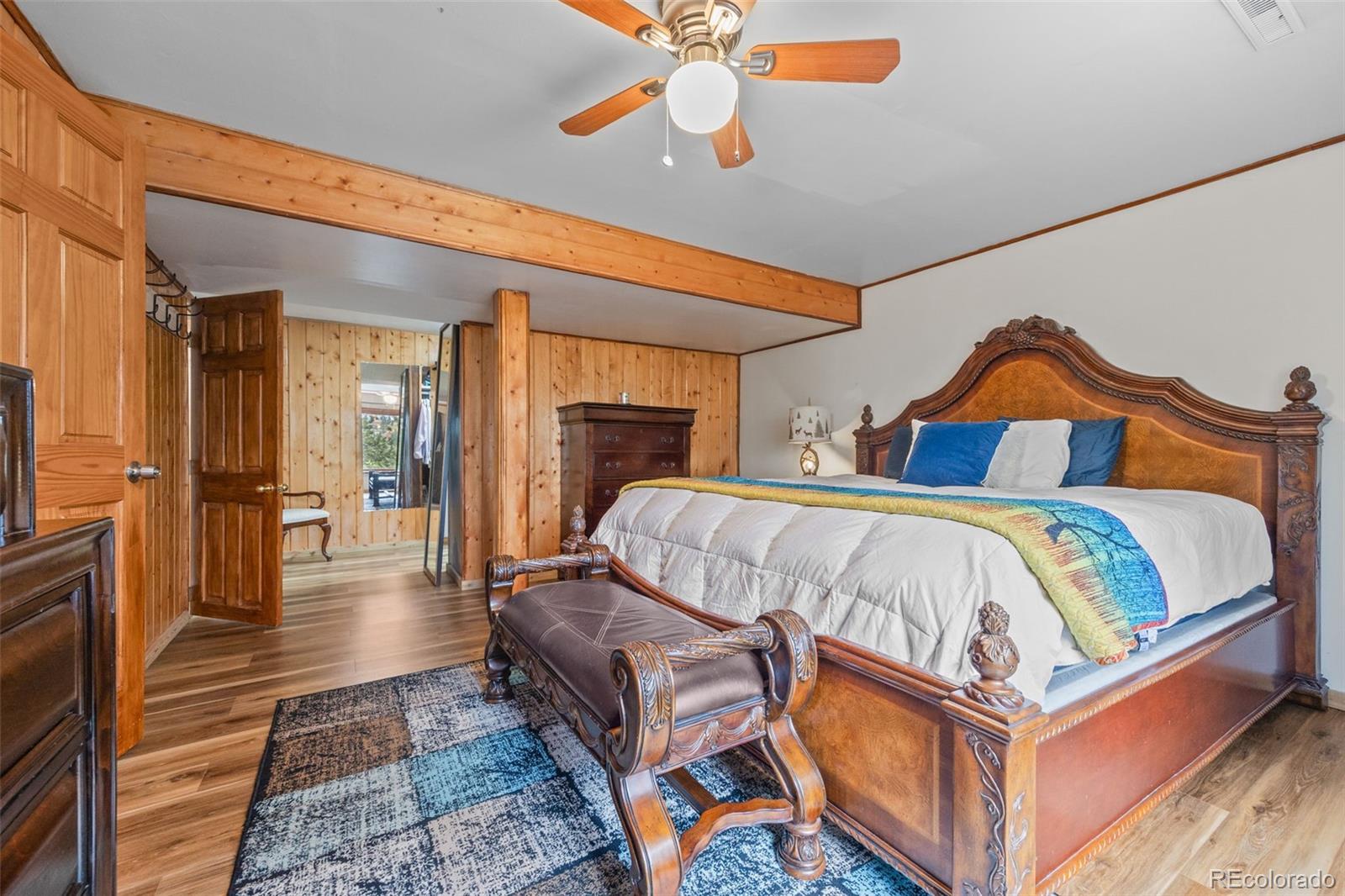 41 Yew Lane Bailey, CO 80421 - Photo 34 of 47 a bedroom with bed and wooden floor