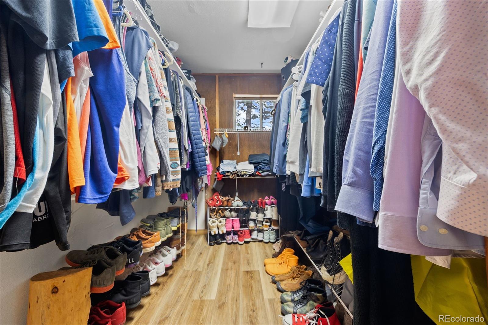 41 Yew Lane Bailey, CO 80421 - Photo 35 of 47 a view of walk in closet with clothes and shoes