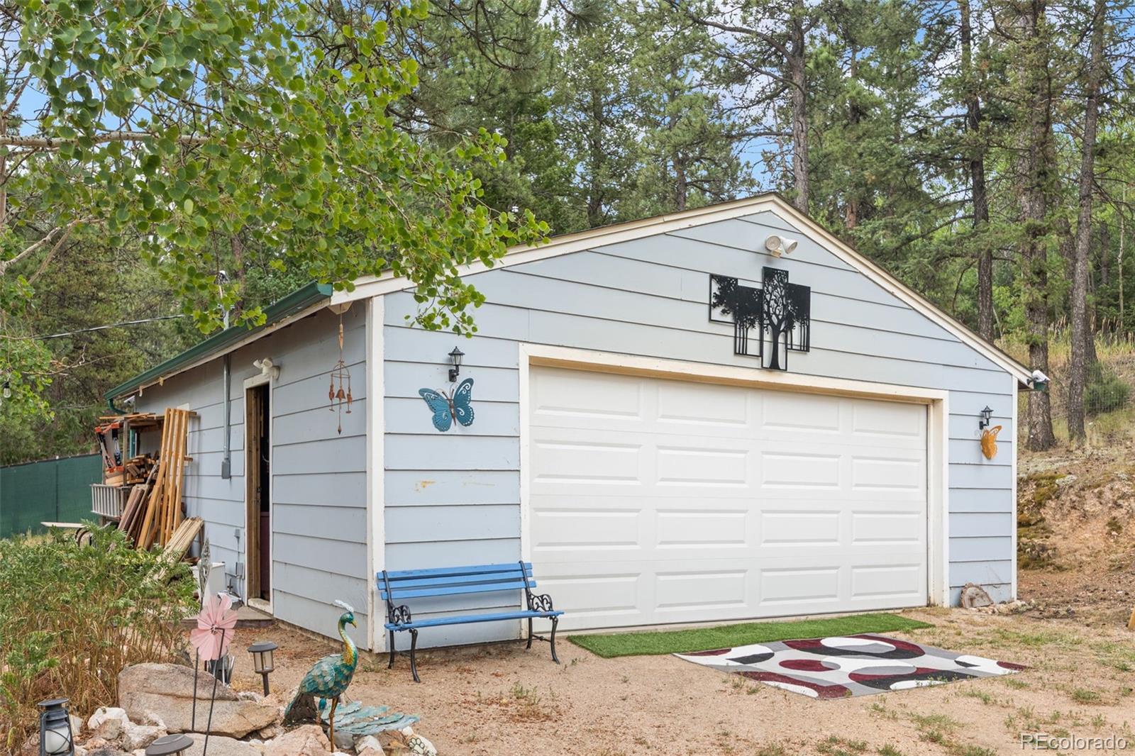 41 Yew Lane Bailey, CO 80421 - Photo 4 of 47 a view of a house with a garage