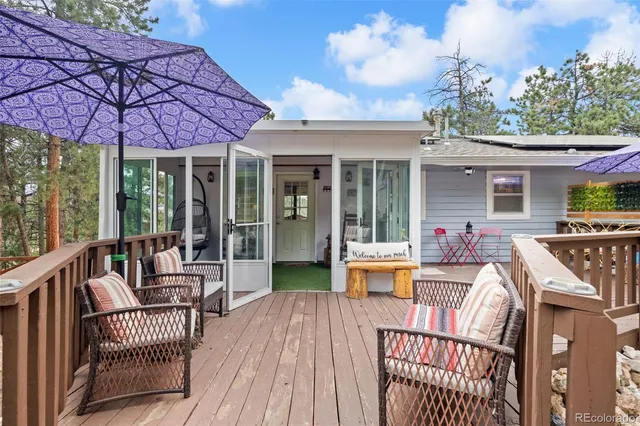 a view of a house with a patio and wooden flooring