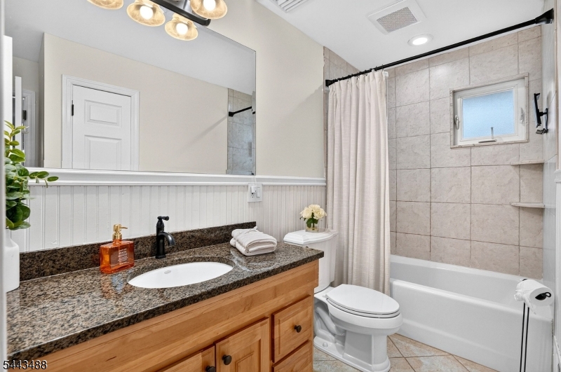 151 East Prospect Street Clark, NJ 07066 - Photo 19 of 31 a bathroom with a granite countertop sink and a mirror